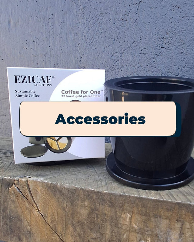 An Ezicaf gold coffee filter sitting on a wooden bench